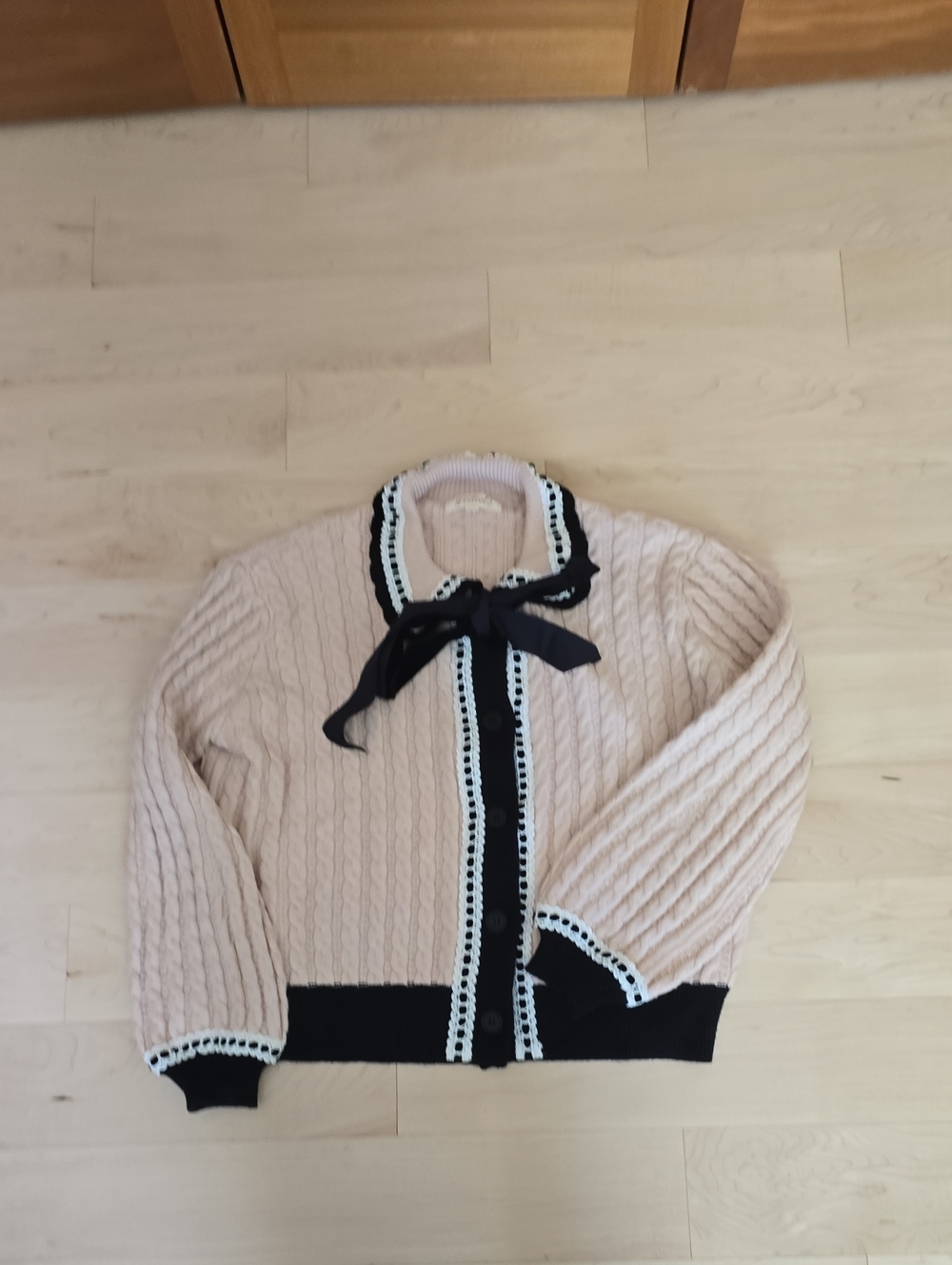 Listicle Cream Cable-Knit Cardigan with Black Trim and Bow